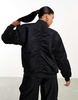 Nike reversible varsity bomber jacket in black