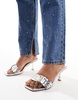 Simmi London Bexley mid heeled mules with eyelet buckle detail in silver