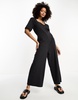 ASOS DESIGN jersey button front chuck on jumpsuit in washed black