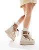 ASOS DESIGN Alpine faux shearling lace up snow boots in off-white