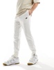 Nike Club logo knit sweatpants in off white