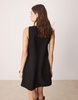 ASOS DESIGN corduroy pinafore mini dress with oversized pockets in black