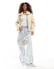 Bershka faux shearling trim aviator jacket in cream contrast