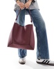 ASOS DESIGN paneled tote bag with knot handle in burgundy