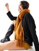 ASOS DESIGN supersoft scarf with tassels in mustard yellow