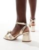 ASOS DESIGN Hansel knotted mid heeled sandals in gold