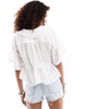 Free People low v neck floaty blouse with broderie in ivory