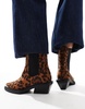 ASOS DESIGN Aruba flat western boots with toe cap detail in leopard