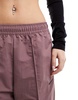 Nike Trend woven baggy parachute pants in smokey mauve