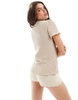 Vila plisse high neck short sleeve t-shirt with lettuce edge detail in beige