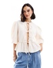 ASOS DESIGN textured peplum tie shirt top in ivory