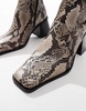 ASOS DESIGN Ria mid heel leather boots in natural snake