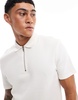 ASOS DESIGN waffle polo with zipper in cream