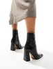 ASOS DESIGN Wide Fit Everest flared heel boots in black