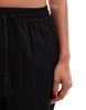 Accessorize wide leg beach pants in black