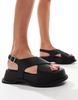 Truffle Collection chunky cross strap sandals in black