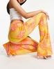 Naked Wardrobe high waist flared pants in neon snake print