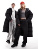 COLLUSION Unisex maxi puffer jacket with hood in black