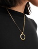 Petit Moments serena stainless steel long necklace with circular pendant in gold