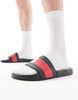 Tommy Hilfiger rubber flag slides in black