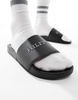 Tommy Hilfiger raised logo pool slides in black