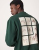 ASOS DESIGN oversized sweatshirt with chest embroidery and mountain back print in dark green