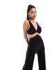 ASOS DESIGN trim detail halter cross back jumpsuit in black