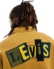 Levi's Skateboarding chenille patch back logo relaxed fit half zip sweatshirt in dark yellow