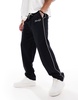 ASOS DESIGN straight leg sweatpants with embroidery and tipping details in black