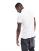 Tommy Hilfiger flag logo cuff slim polo shirt in white