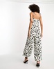 River Island leopard print tie strap wide leg jumpsuit in black and white