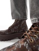 ASOS DESIGN lace up worker boots in brown monogram with chunky sole