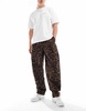 Vans range baggy tapered elastic waist pants in multi