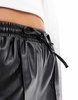 River Island elasticated waist PU runner shorts in black