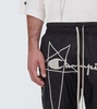 x Champion® nylon sweatpants