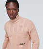 Distressed virgin wool turtleneck sweater