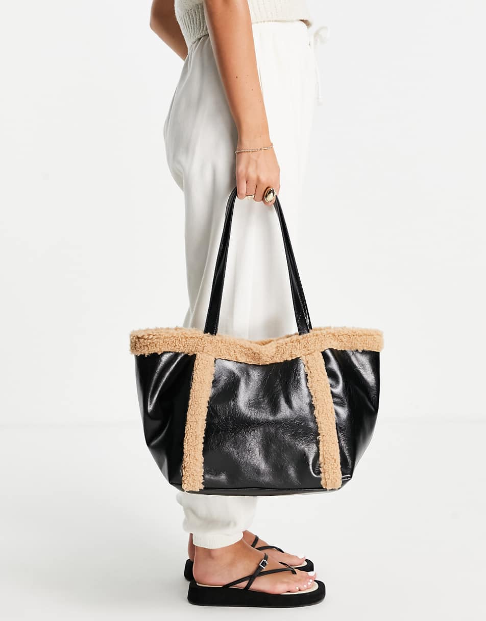 ASOS DESIGN tote bag with faux shearling trim in black