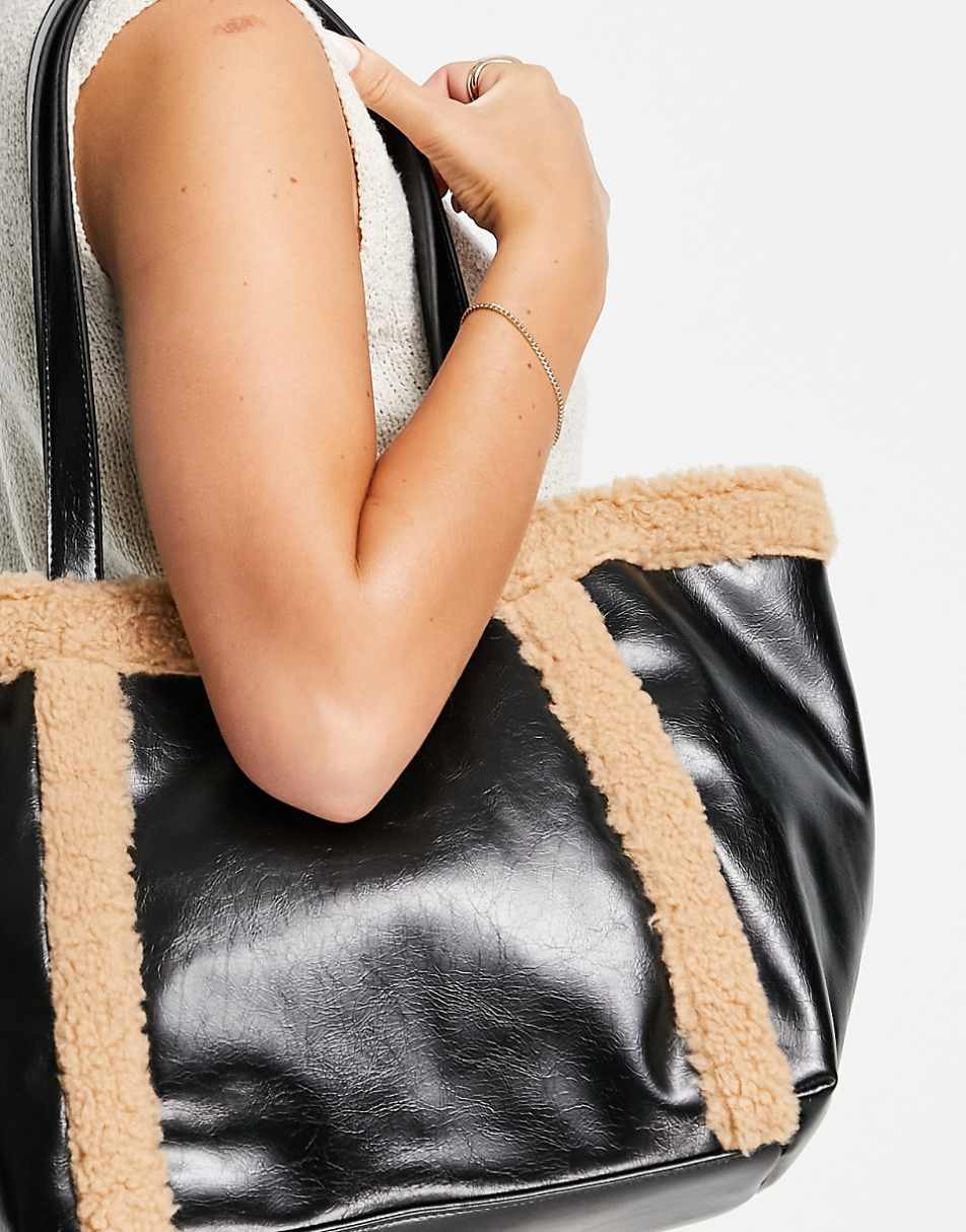 ASOS DESIGN tote bag with faux shearling trim in black