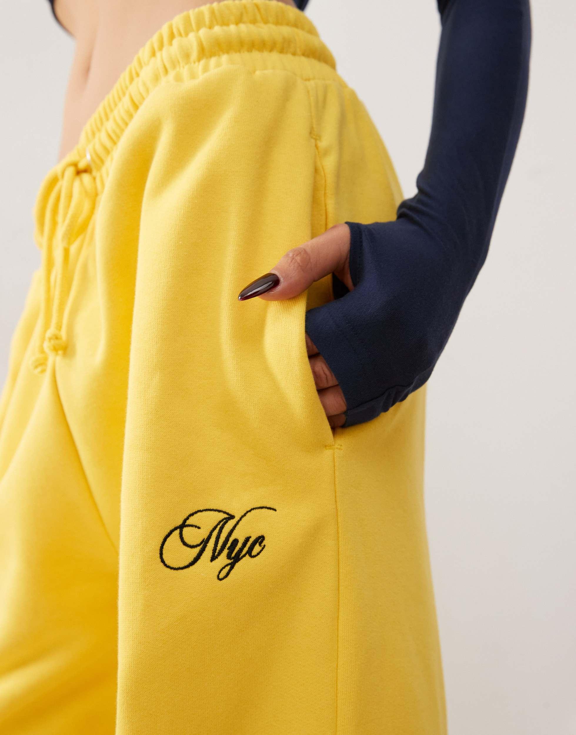 COLLUSION oversized straight leg sweatpants in yellow with embroidery