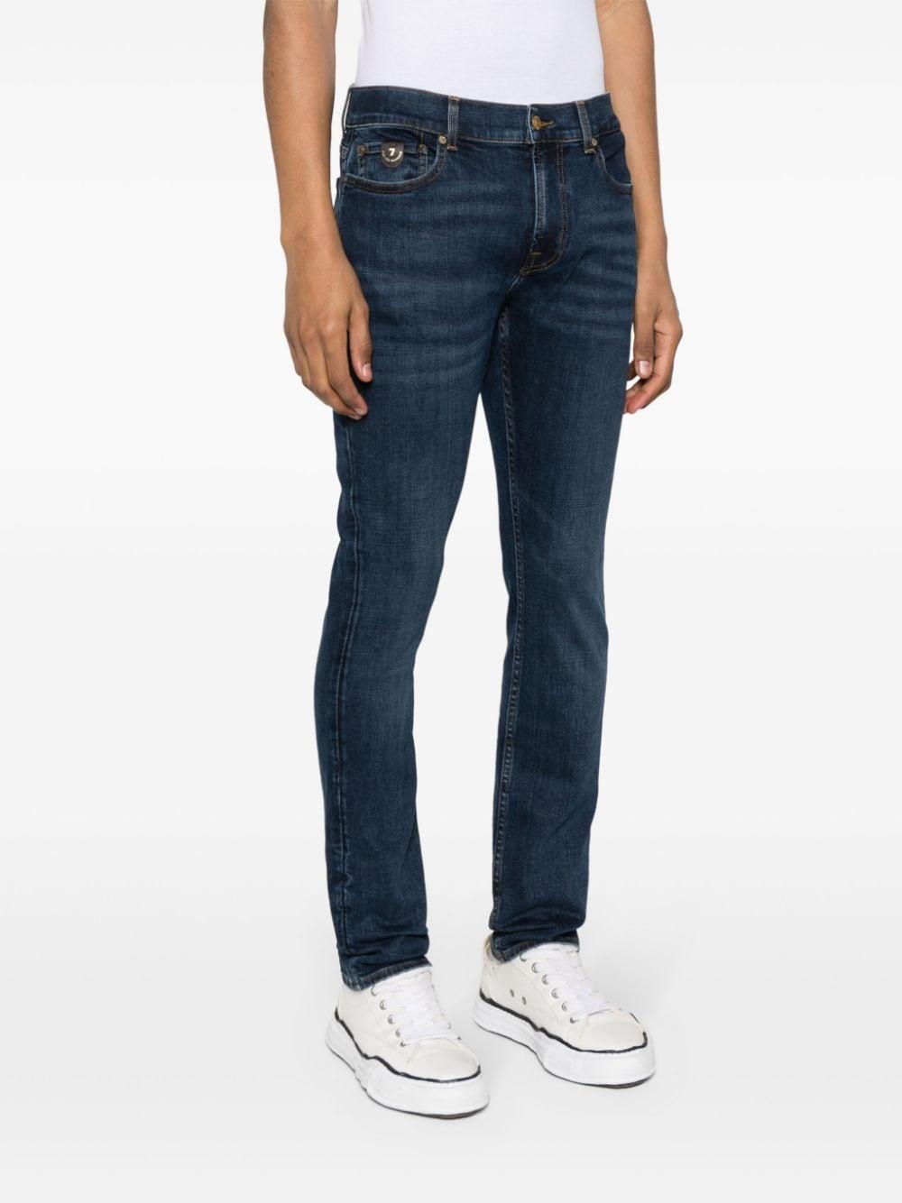 Paxtyn mid-rise skinny jeans