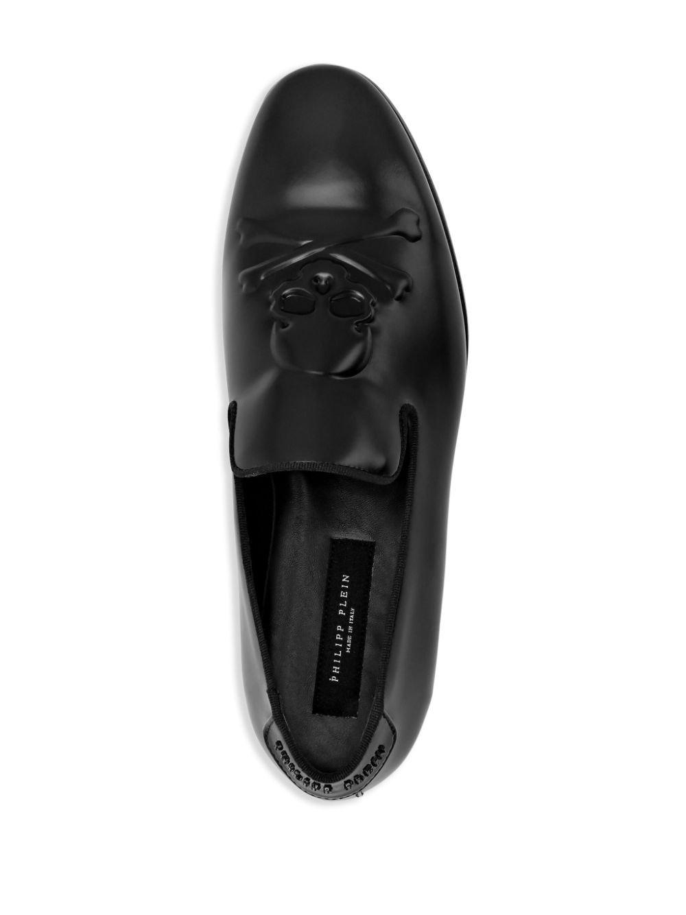 skull-embossed leather loafers