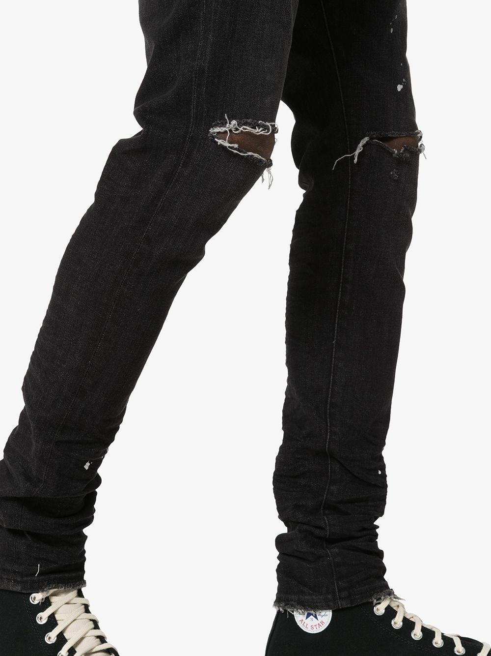 Distressed ripped knee jeans