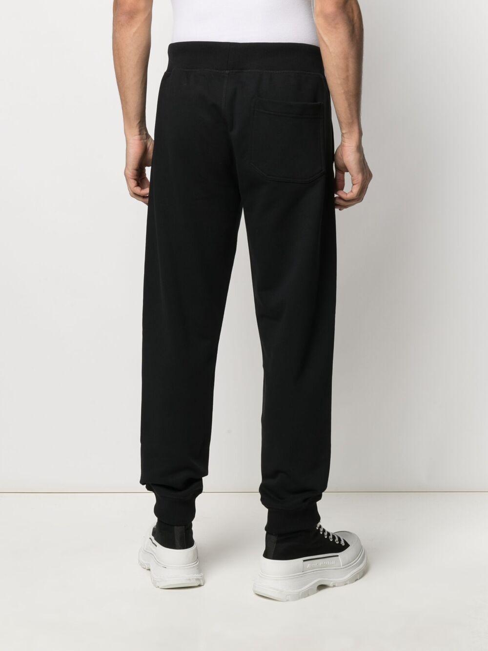 Impress slogan-print track pants