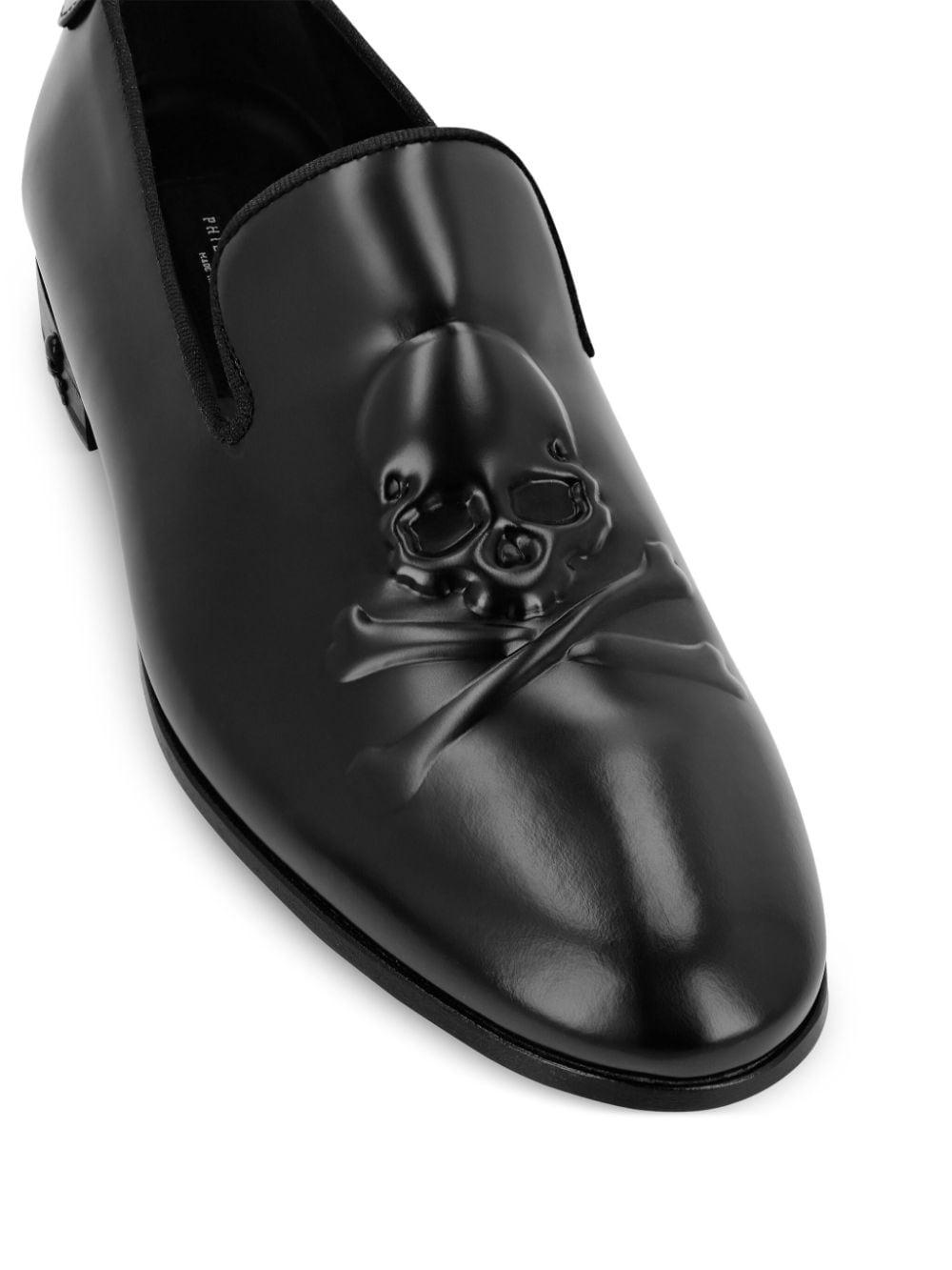 skull-embossed leather loafers