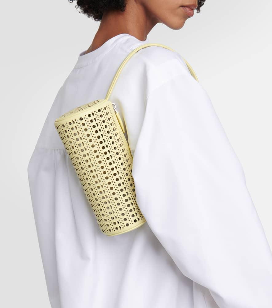 Tube perforated leather shoulder bag