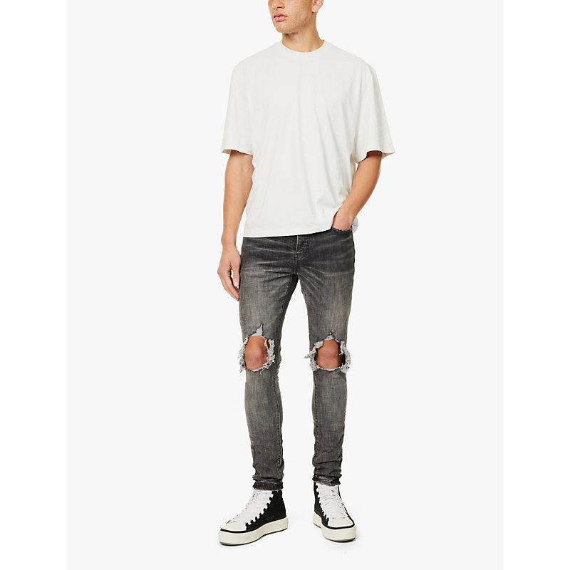 Dirty Blowout busted-knee tapered-leg stretch-denim jeans